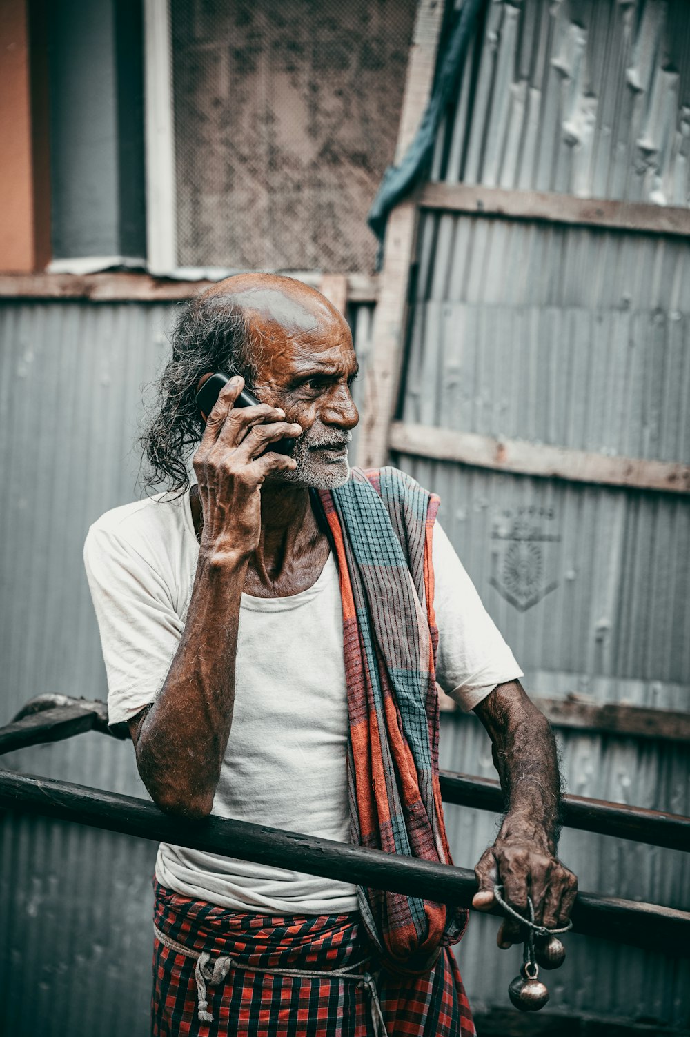 an old man talking on a cell phone