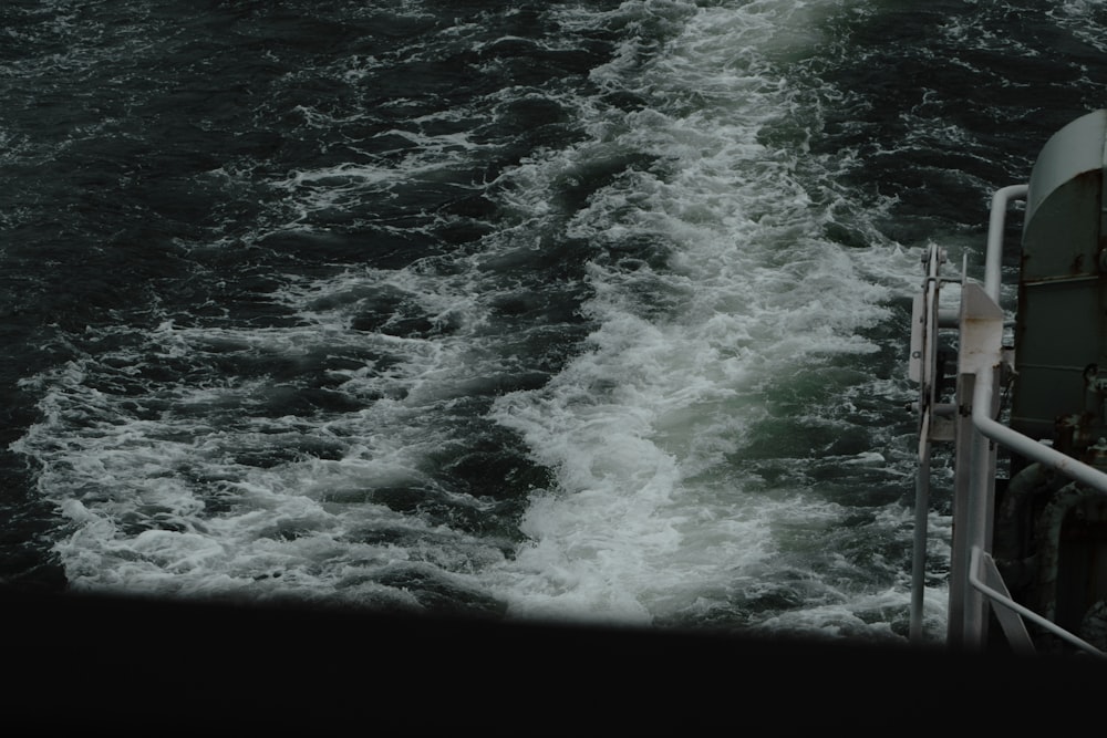 a boat traveling through a body of water