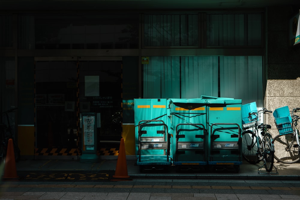 a blue truck parked next to a building