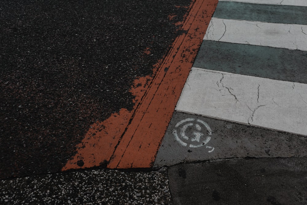 a stop sign painted on the side of a road