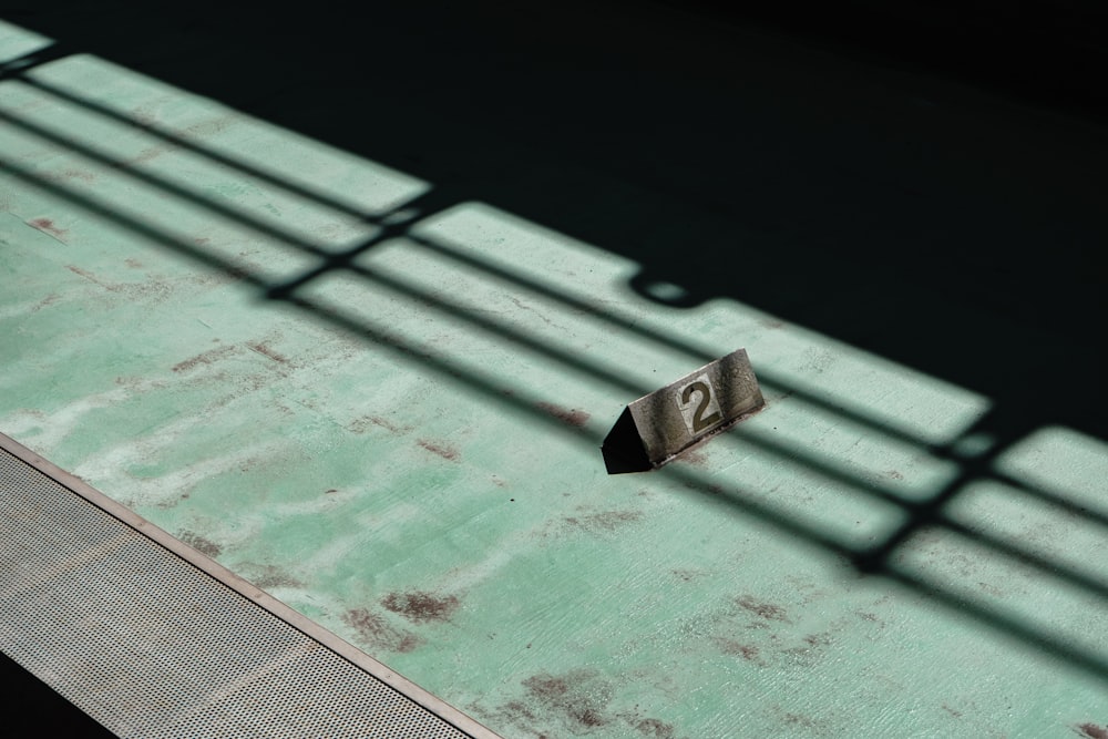 a piece of luggage sitting on top of a green floor