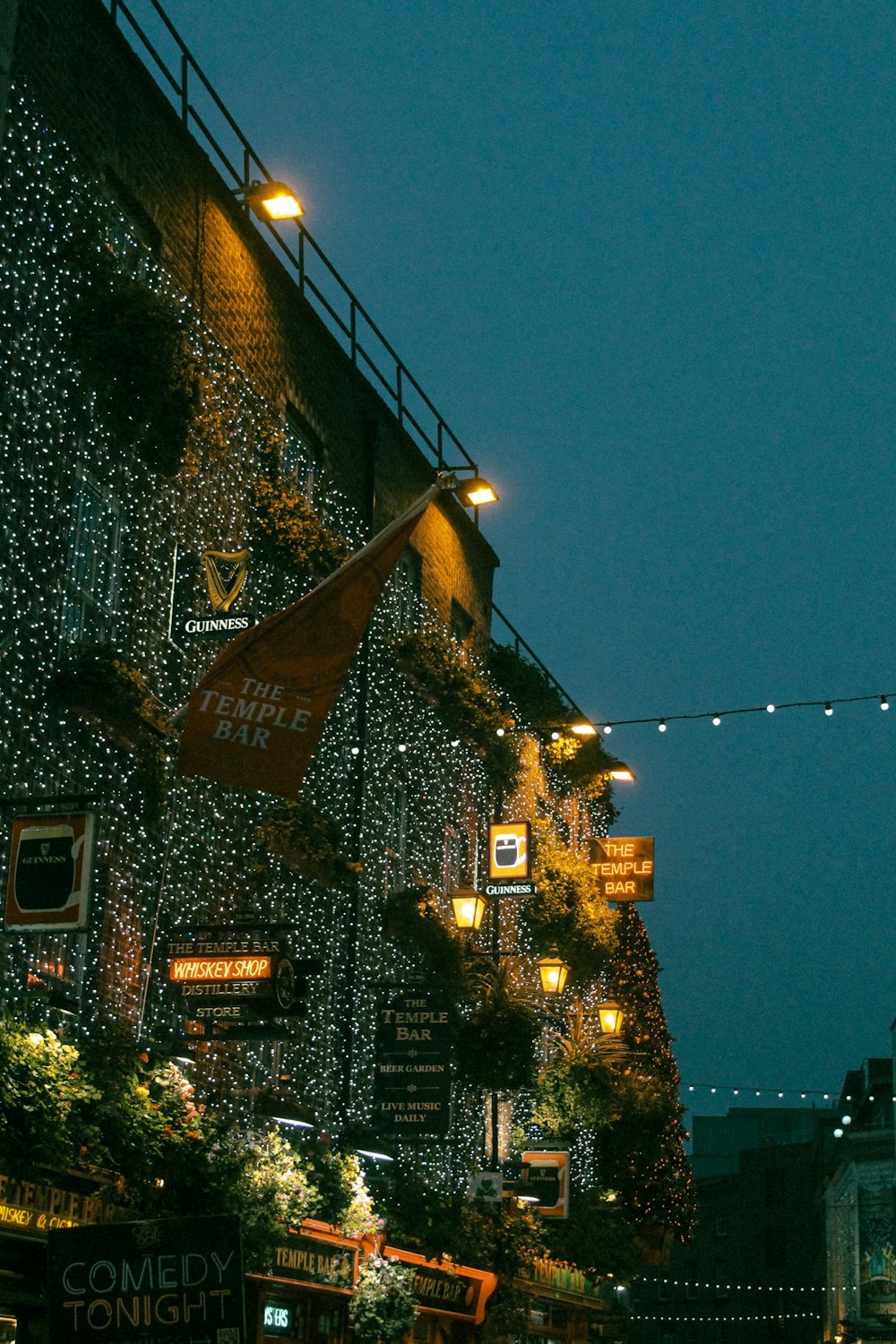 a building covered in christmas lights at night