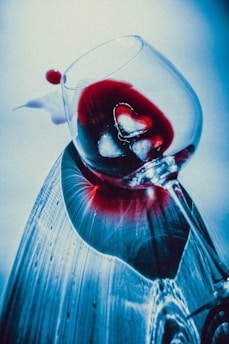 a wine glass with a liquid inside of it