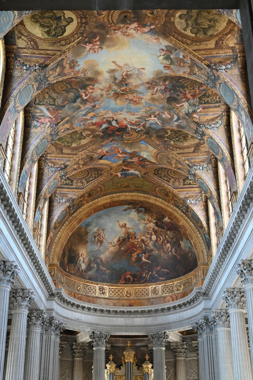 the ceiling of a church with a painting on it