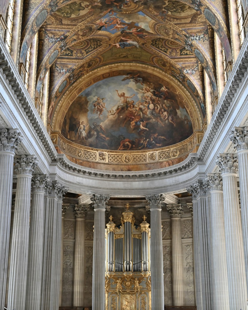 a church with a large painting on the ceiling
