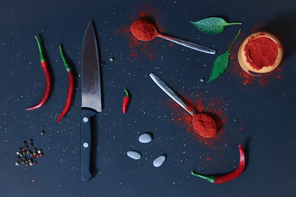 a knife and some red stuff on a table