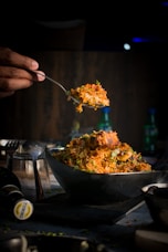 a person is spooning food out of a bowl