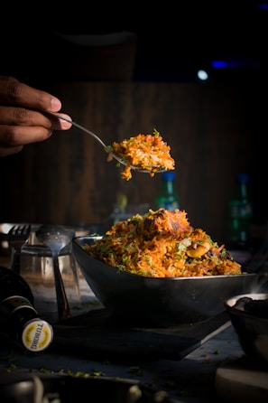 a person is spooning food out of a bowl