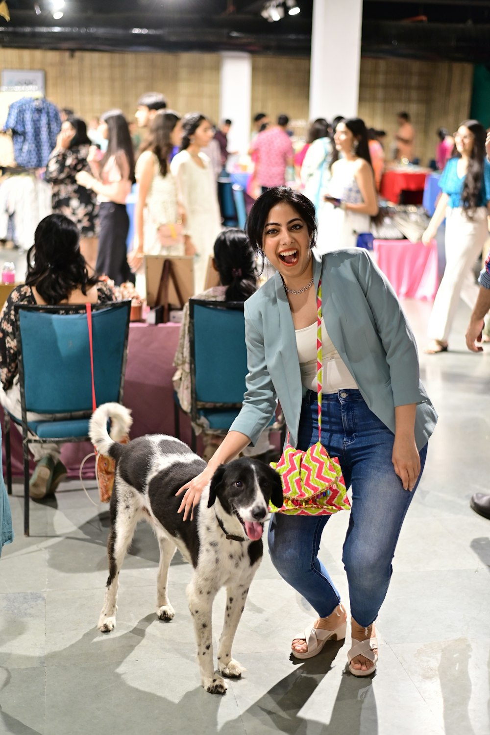 a woman walking a dog on a leash