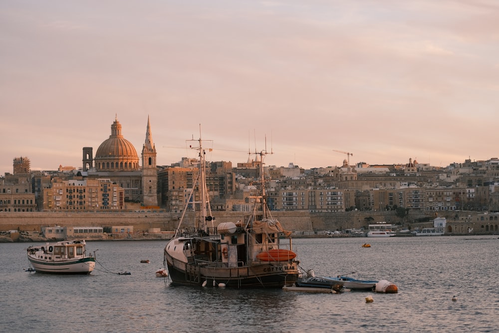 a couple of boats that are sitting in the water