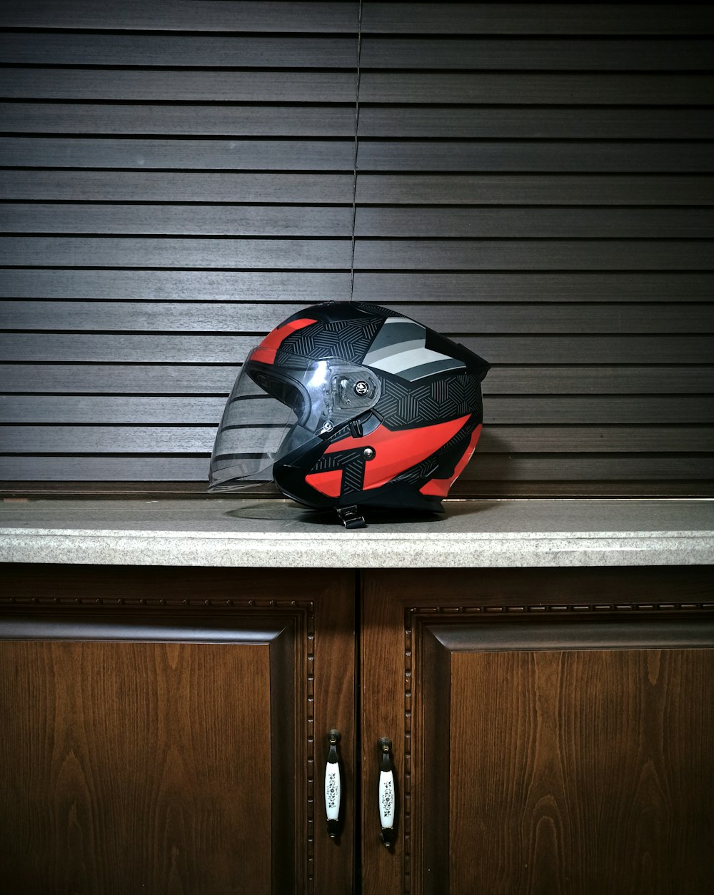 a motorcycle helmet sitting on top of a counter