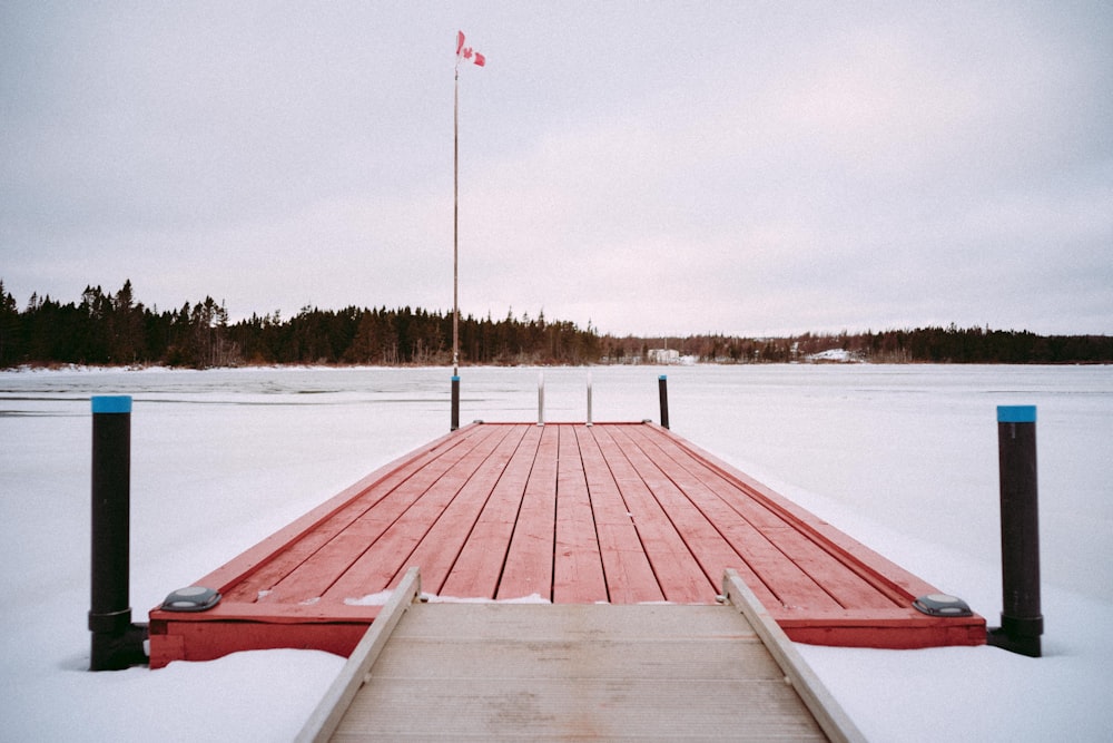 a wooden dock with a flag on top of it