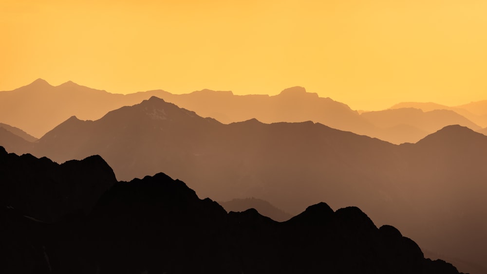 a view of a mountain range at sunset