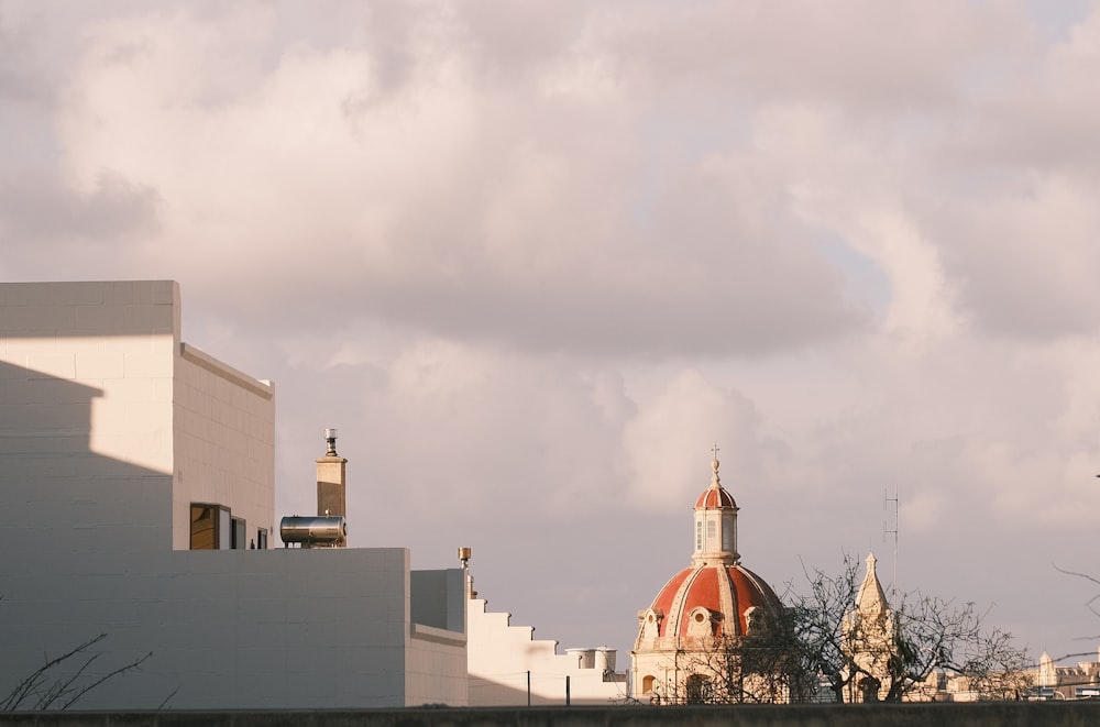 a view of a building with a clock tower in the background