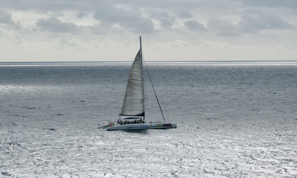 a sailboat in the middle of a body of water