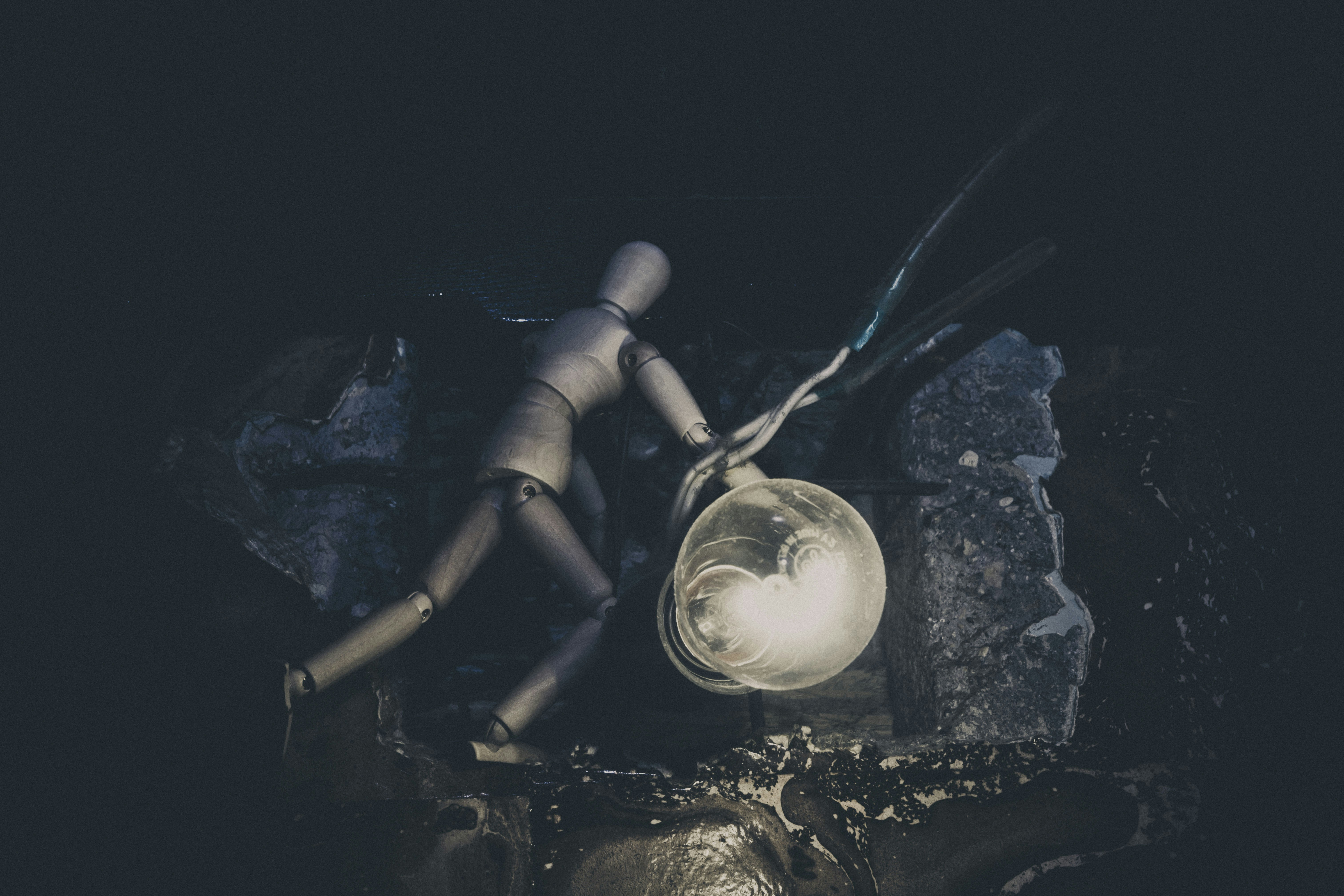 a pair of gloves and a light in a dark room