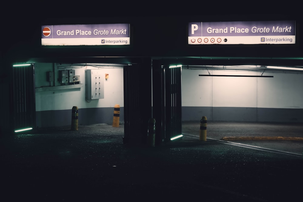 a parking garage with a fire hydrant at night