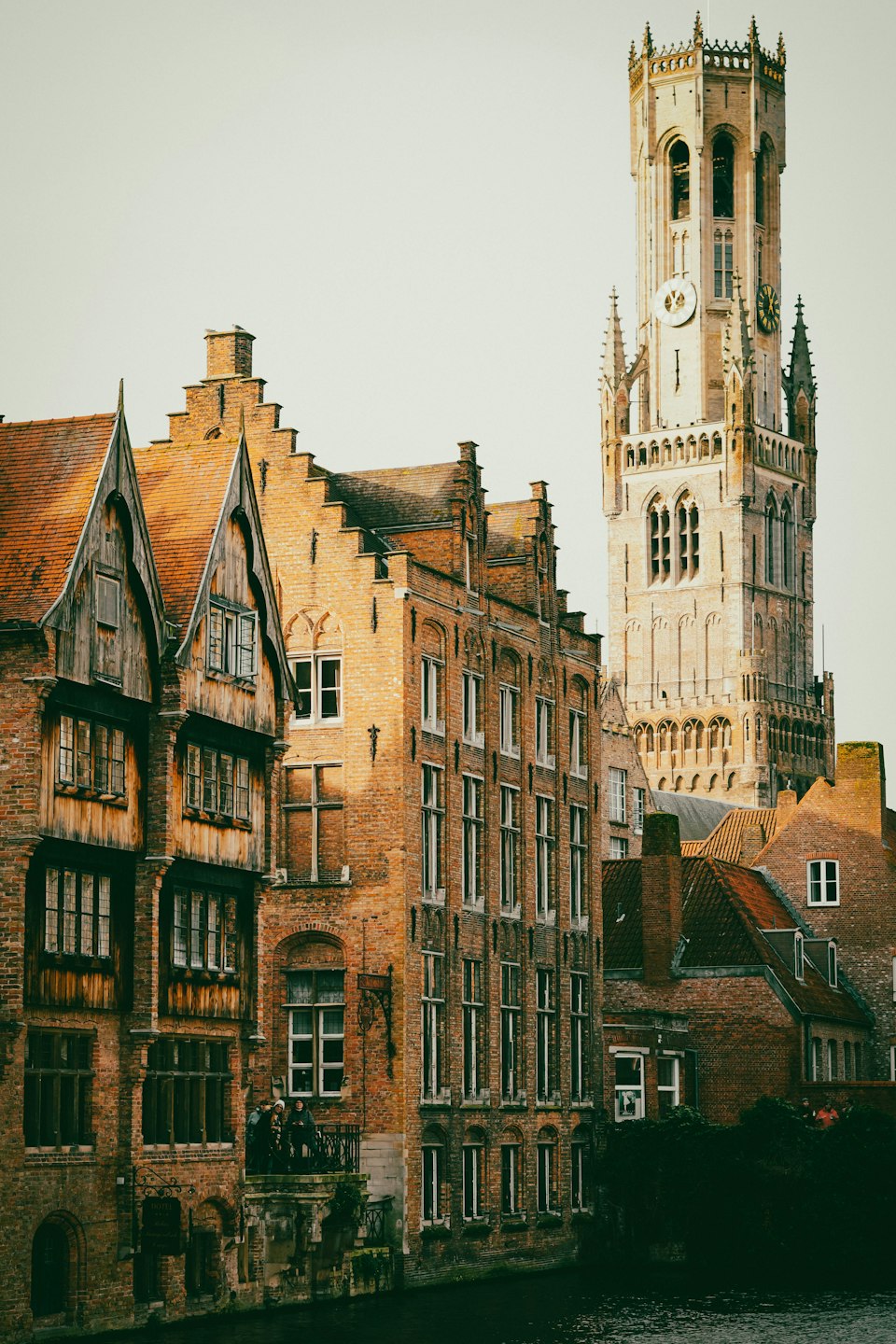 The Belfry of Bruges towering over the step-gabled houses of the Markt square