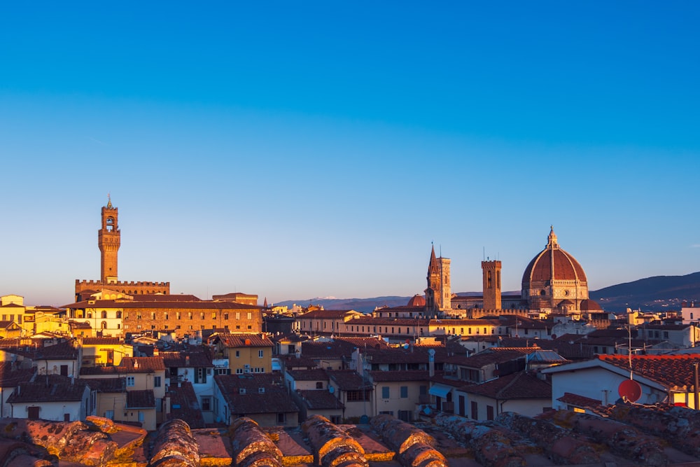 a view of a city with a clock tower in the background