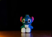 a small toy sitting on top of a wooden table
