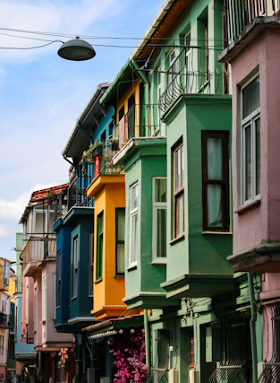 a row of multicolored buildings on a city street