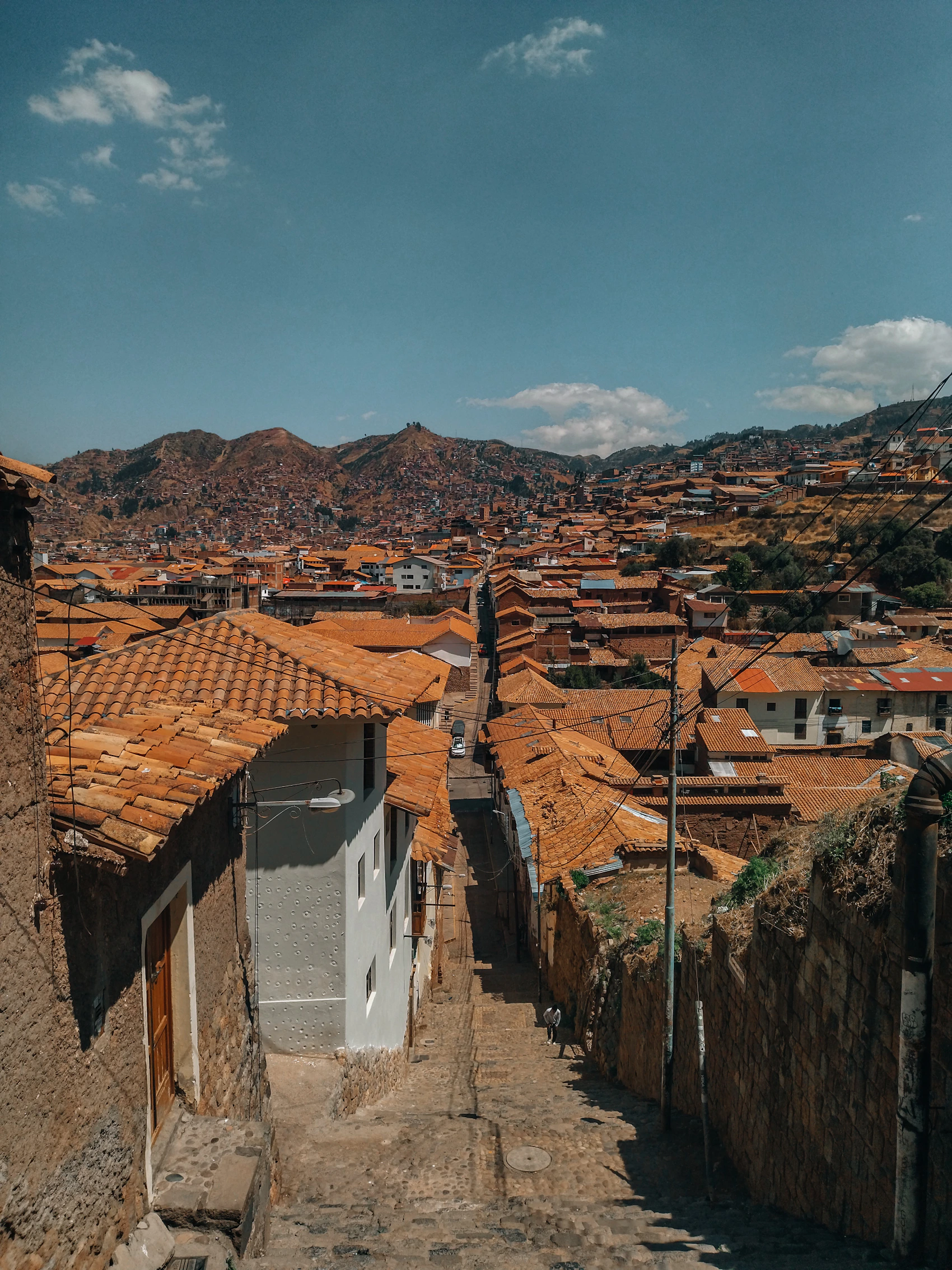 A highland settlement spread beneath the mountains near Cusco