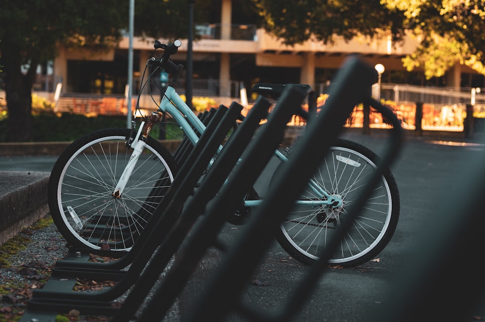 two bikes are parked next to each other in a parking lot