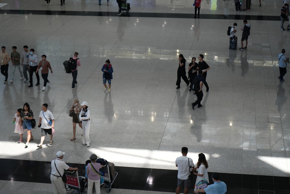 a group of people walking around a building