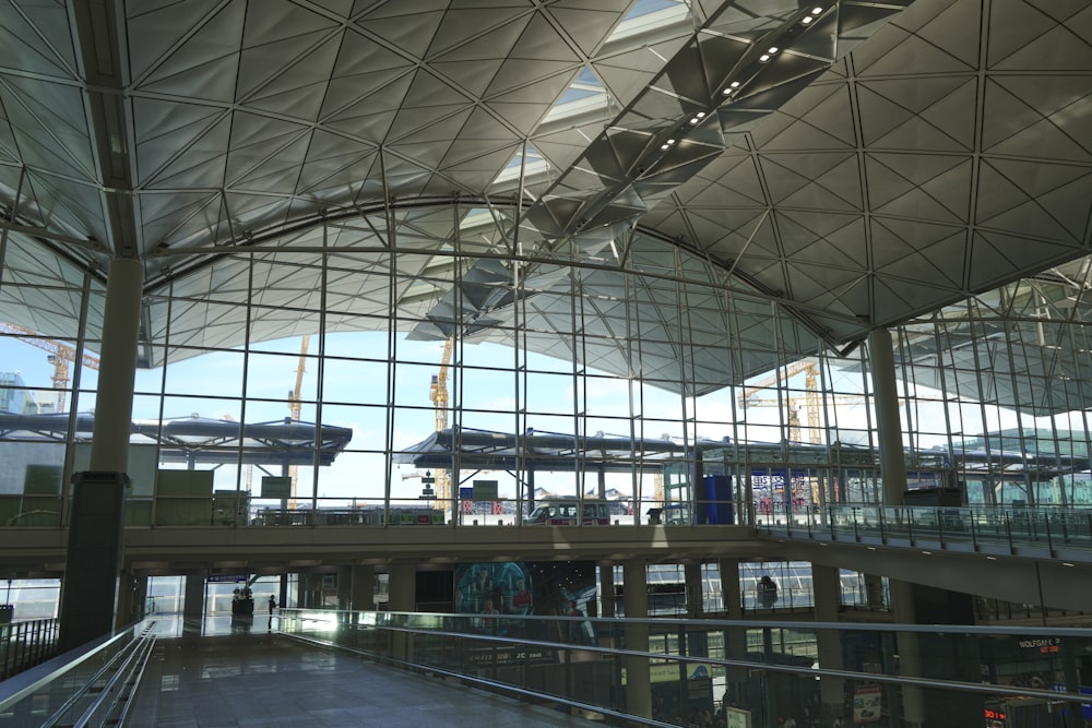 the inside of an airport terminal with glass walls