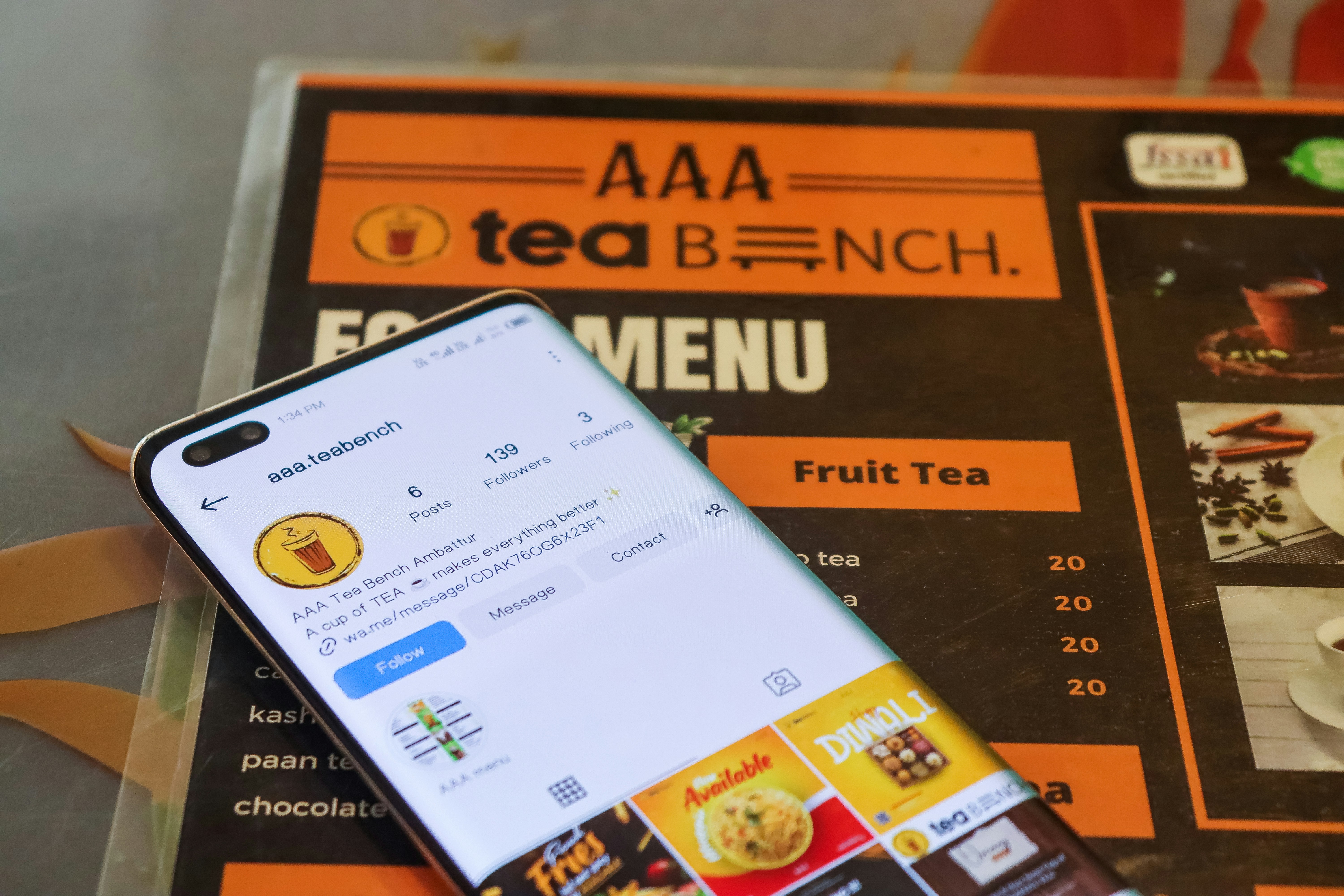 Person holding phone viewing restaurant menu
