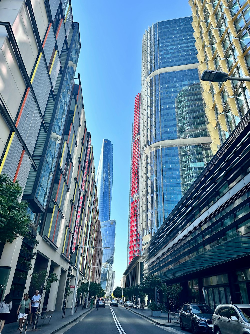 a city street lined with tall buildings next to each other