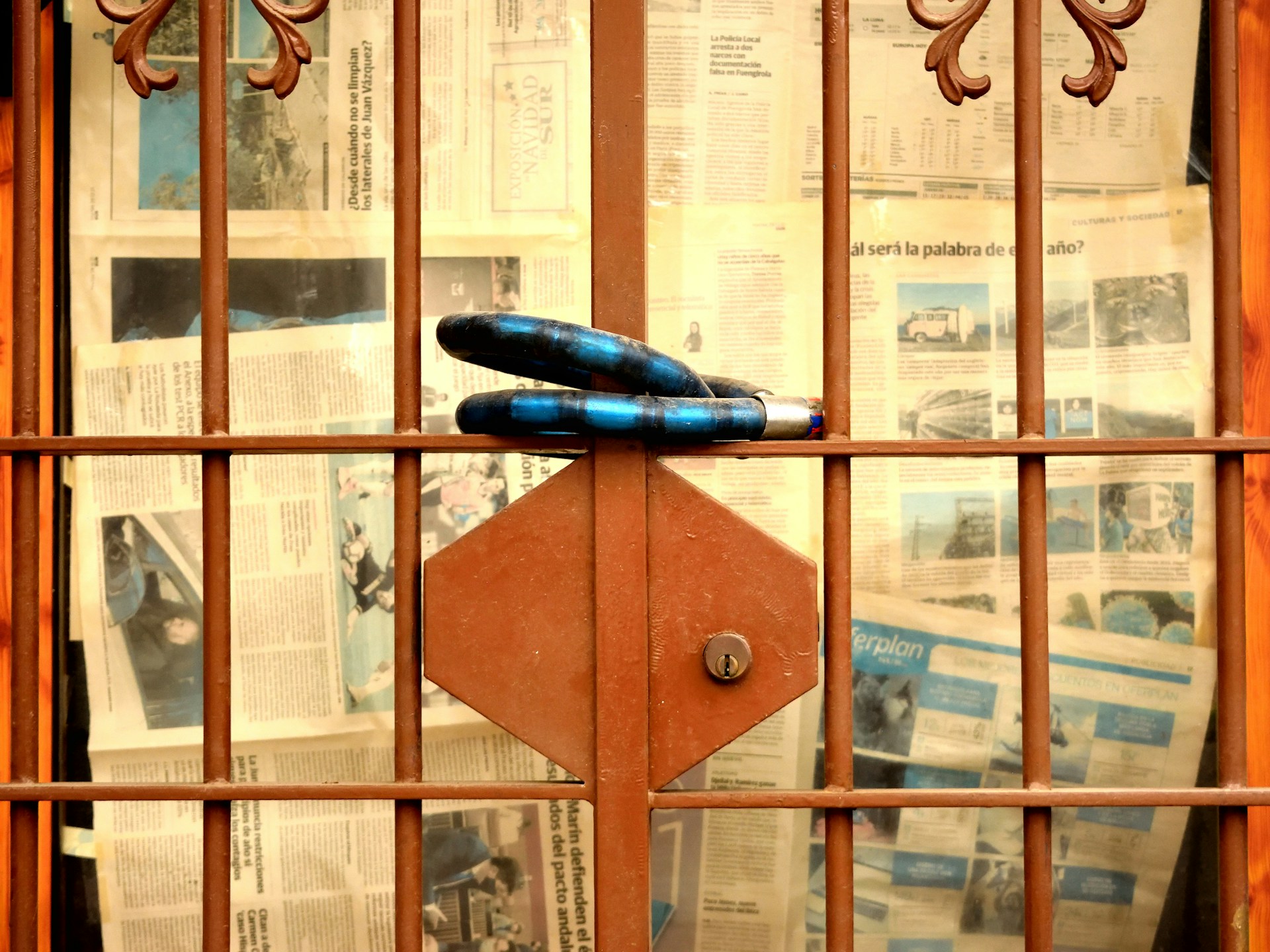 a pair of blue umbrellas sitting on top of a wooden door