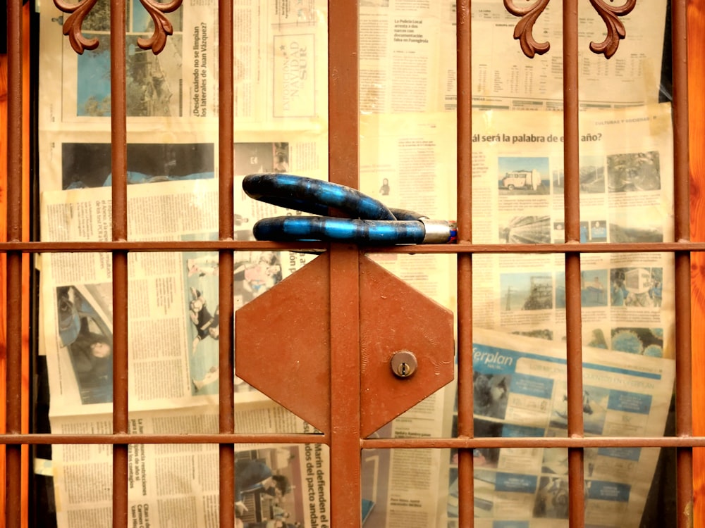 a pair of blue umbrellas sitting on top of a wooden door
