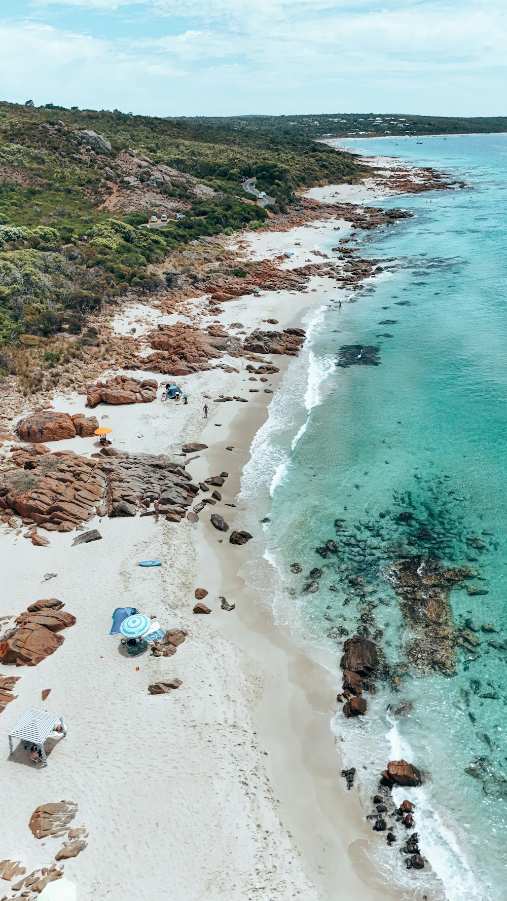 an aerial view of a sandy beach and ocean