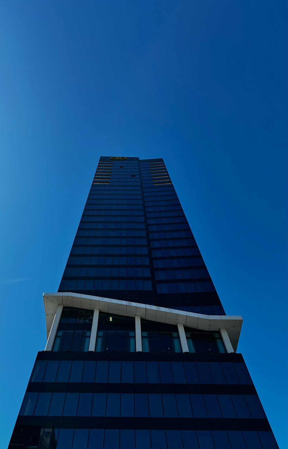 a very tall building with a clock on it's side