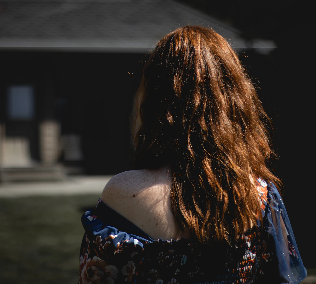 Portrait from behind showing long red hair