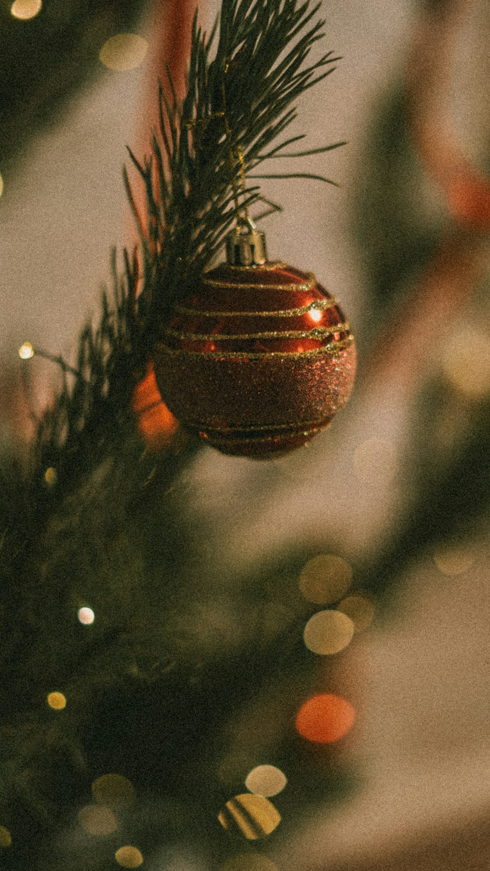 a christmas ornament hanging from a christmas tree