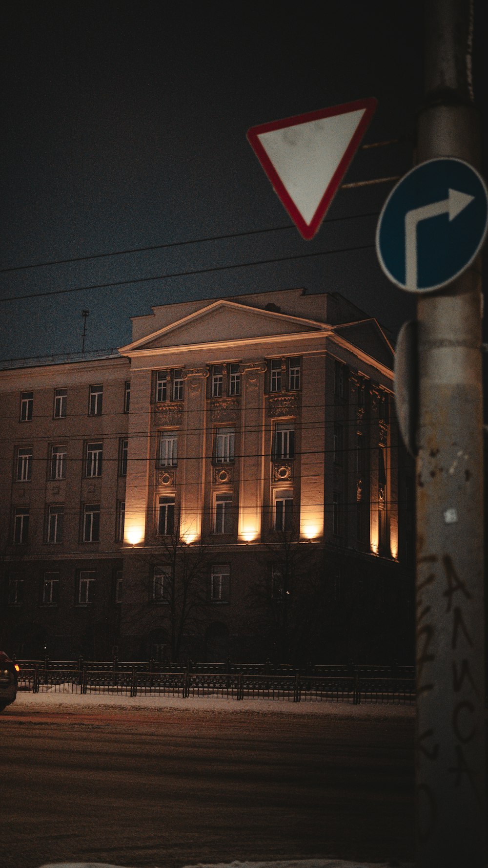 a street sign and a building in the background