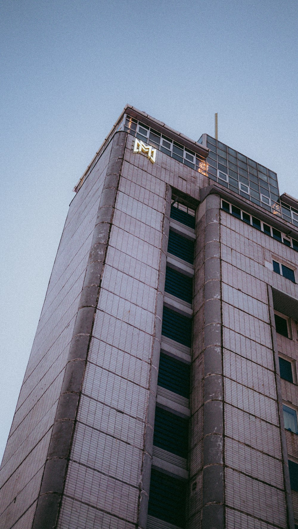 a tall building with a sky background