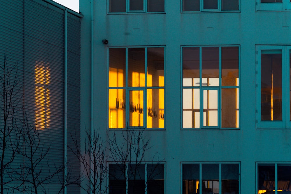 a building with windows and a clock on the side of it