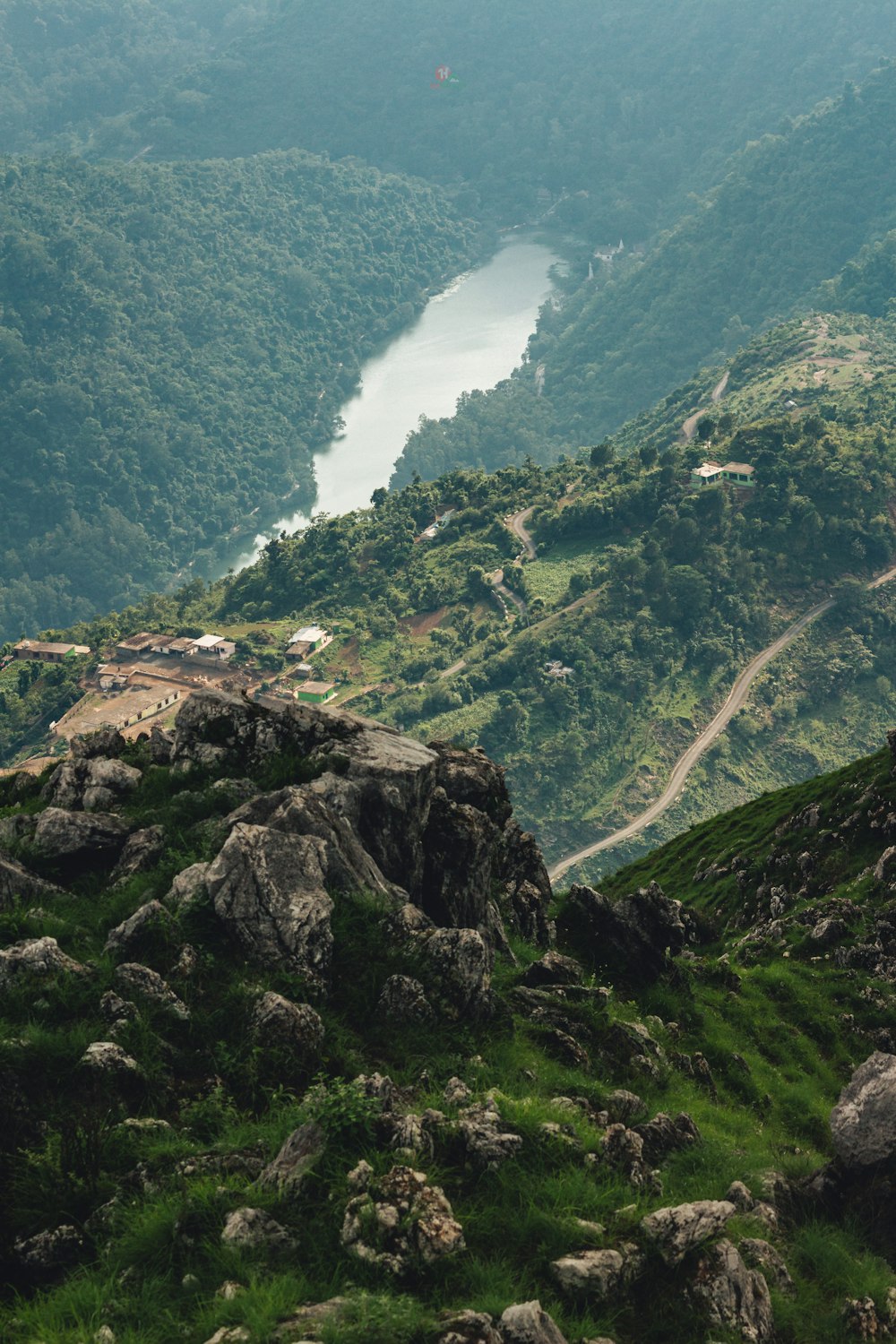 a view of a valley with a river running through it