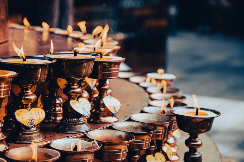 a bunch of candles that are on a table