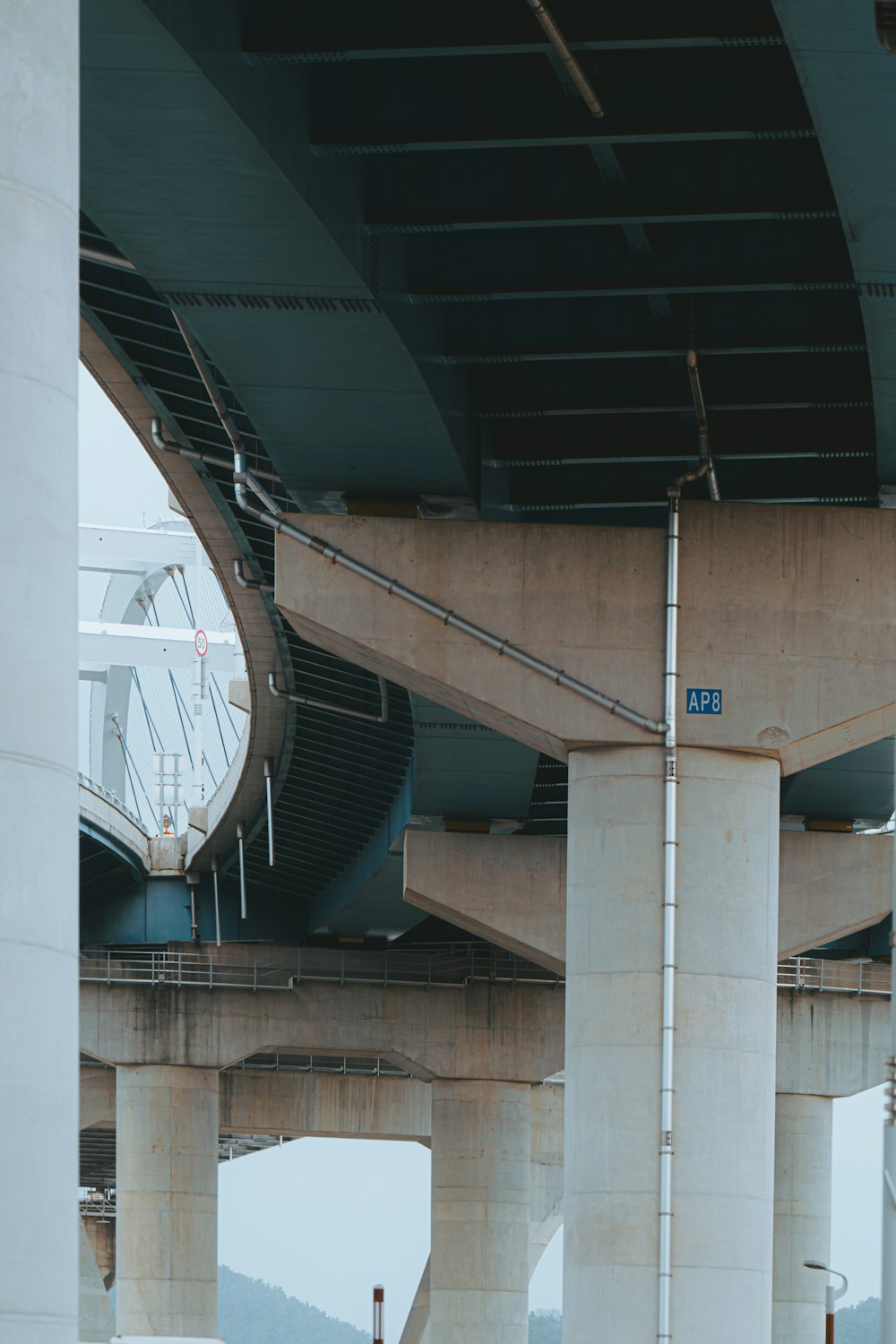 a bridge that has a clock on the side of it