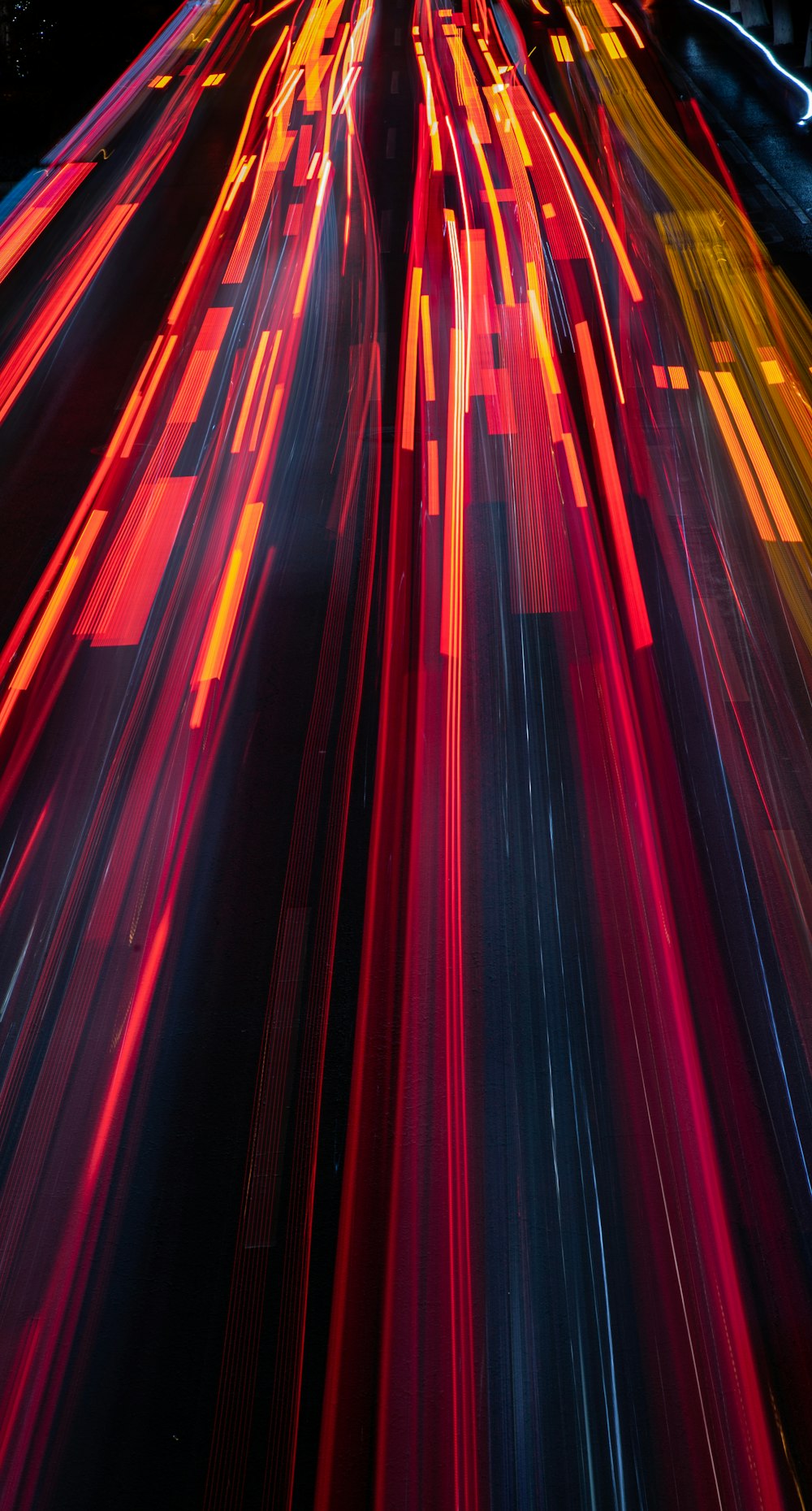 a blurry photo of a city street at night