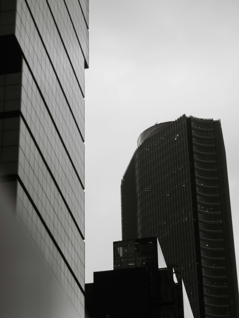 a black and white photo of a tall building