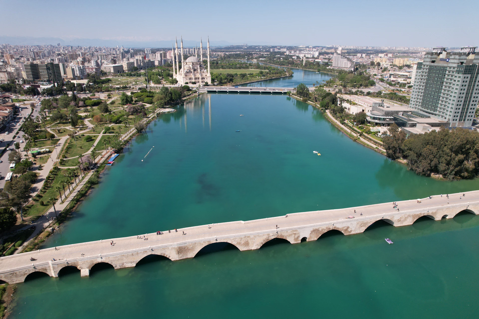 an aerial view of a bridge over a body of water