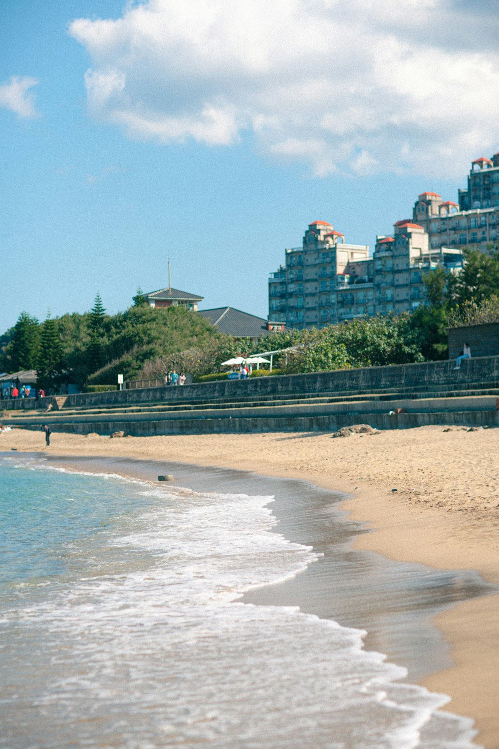 a person riding a surfboard on the beach