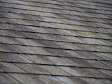a close up of a roof made of wood planks