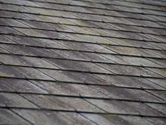 a close up of a roof made of wood planks