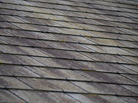 a close up of a roof made of wood planks